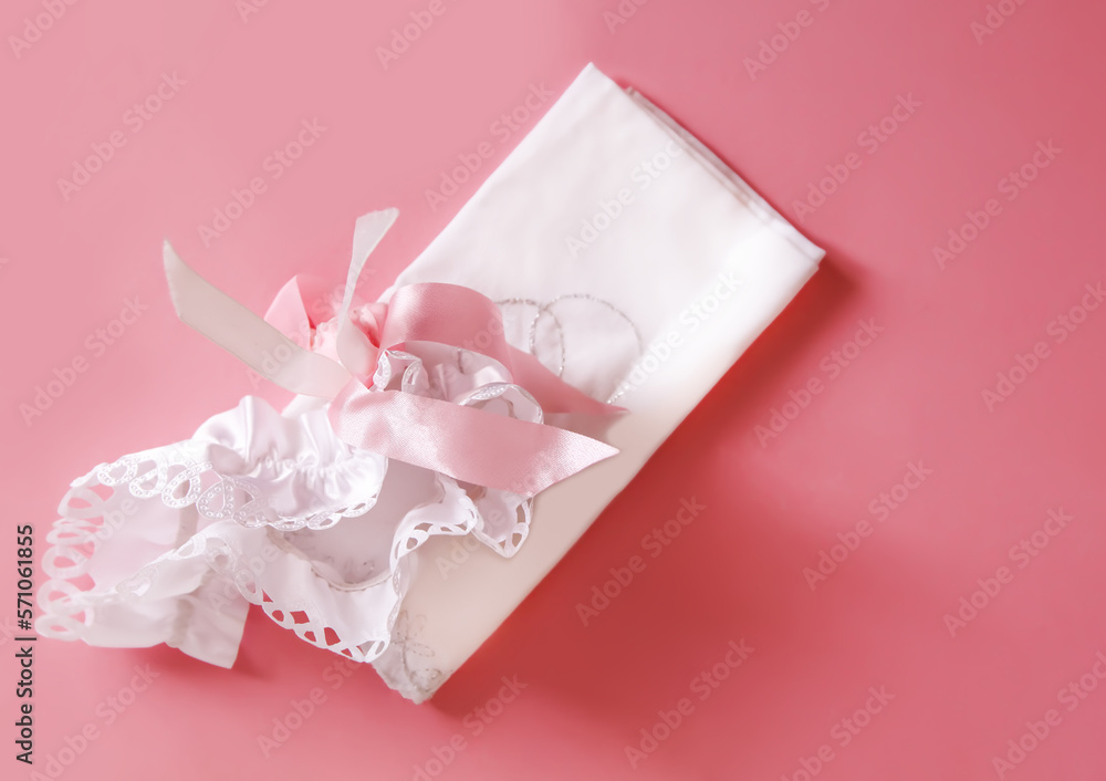 The bride's garter on a pink background. The bride's garter on a pink background.