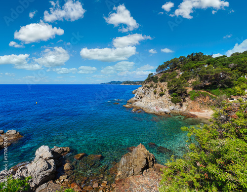 Summer sea rocky coast view with trees and beach  Catalonia  Costa Brava  Spain .