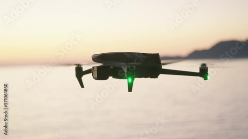 Montenegro, january 2023: camera drone mavic 3 hover over the sea, after sunset photo