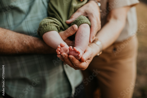 grandparents holding baby