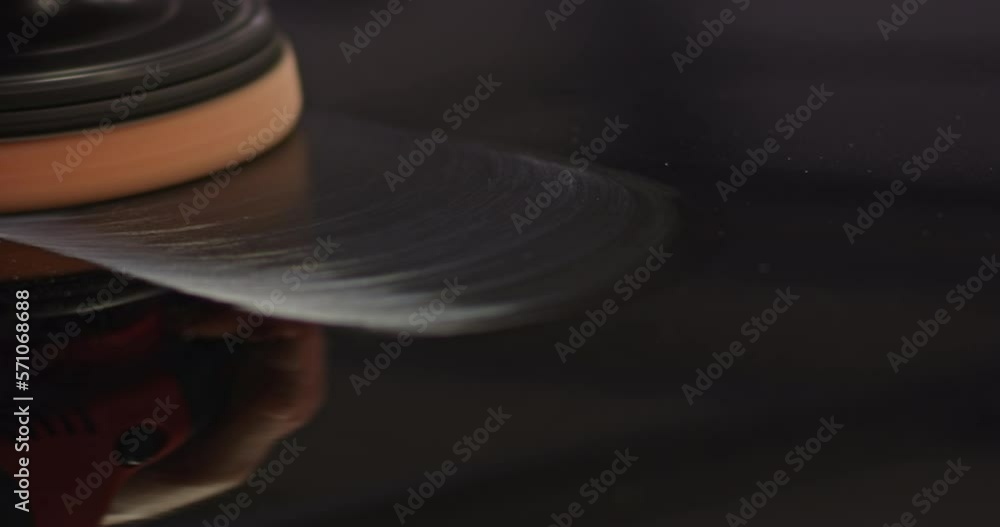 Hands with orbital polisher in auto repair shop Hands with orbital polisher in auto repair shop