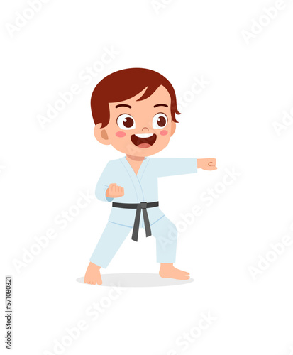cute little kid training and showing karate pose