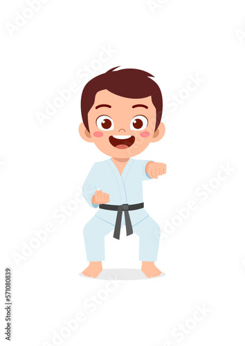 cute little kid training and showing karate pose
