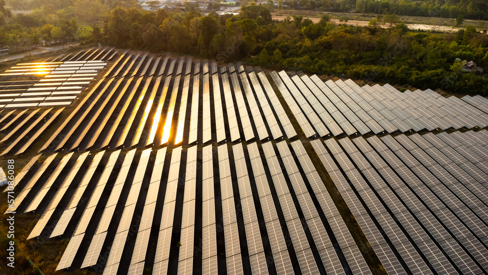 Photovoltaic solar panels at sunrise and sunset.Solar panel cell on dramatic sunset sky background,clean Alternative power energy concept. Photovoltaic solar panels at sunrise and sunset.Solar panel cell on dramatic sunset sky background,clean Alternative power energy concept.