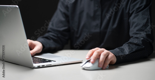 a person working using laptop in the night, overworking concept