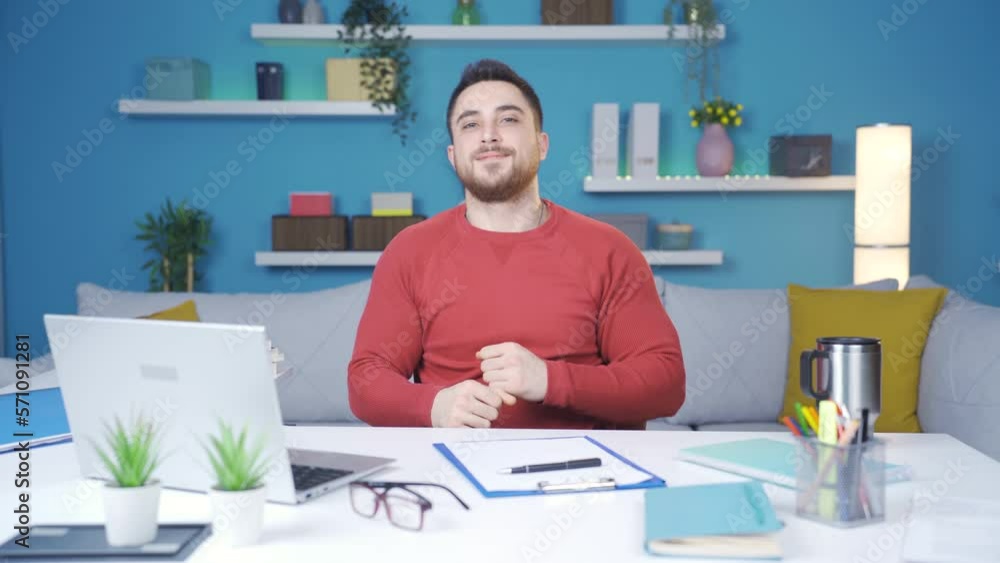 Man working from home office showing how to exercise in office.
Man working from home doing arm and back exercises against camera.
Man working from home office showing how to exercise in office.
Man working from home doing arm and back exercises against camera.
