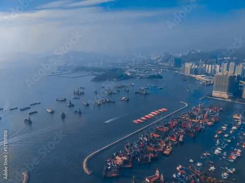 High angle view of the harbour, small ships, buildings from inside the Sky100 Hong Kong International Commerce Center (ICC) building. photo