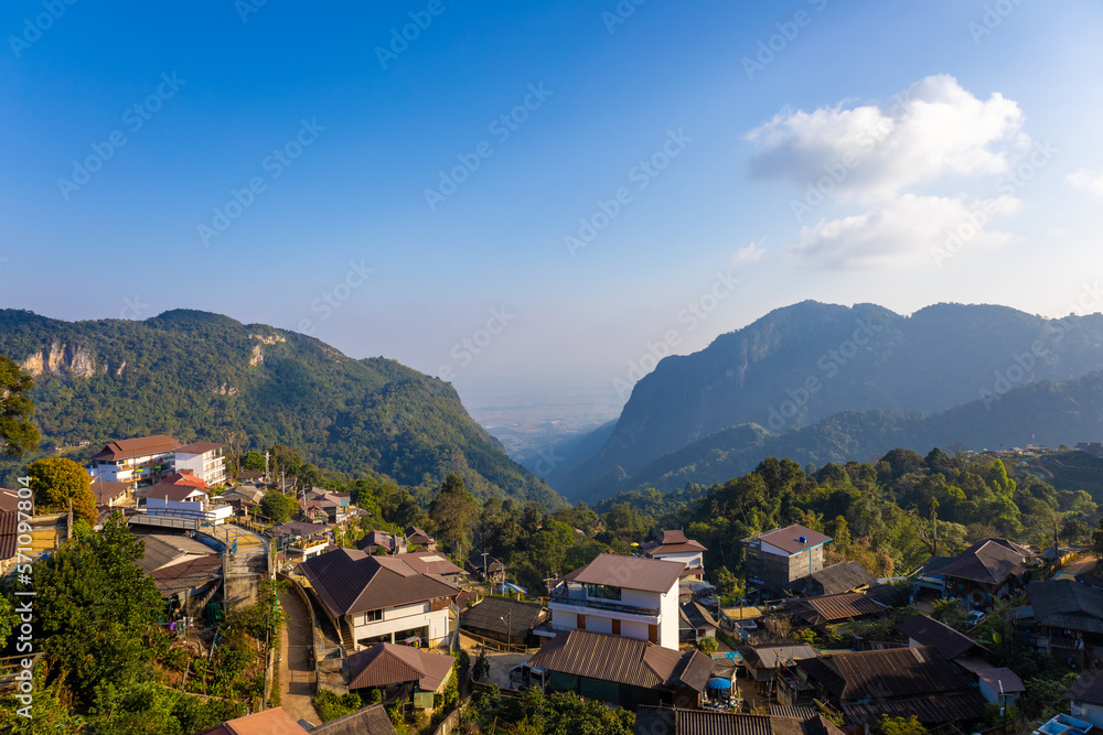Panorama view, blue sky and white clouds, mountain landscape and green trees