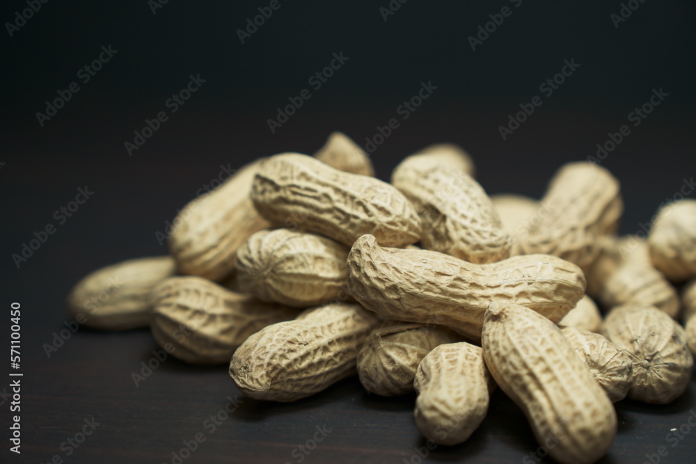 Peanuts close-up on black background. Peanuts close-up on black background.