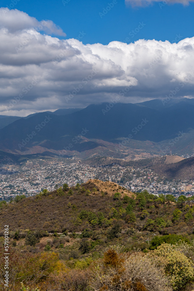 Beautiful view of the large Mexican city of Oaxaca from Monte Alban. View of the endless mountain peaks.