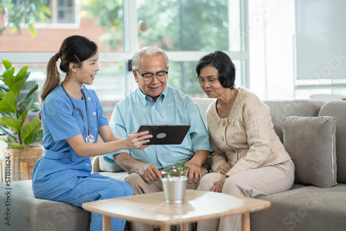 Elderly people healthcare tech and prescription online concept.asian senior people listening to young nurse or doctor explaining therapy treatment effect and how to take pills in a nursing home.