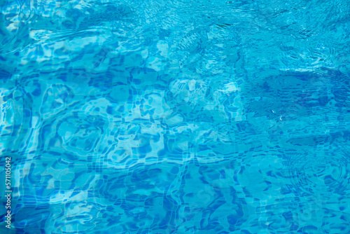 Wallpaper Mural Top view of the water in a deep blue pool lined with small square tiles. Clear blue water in a pool with shallow waves Torontodigital.ca