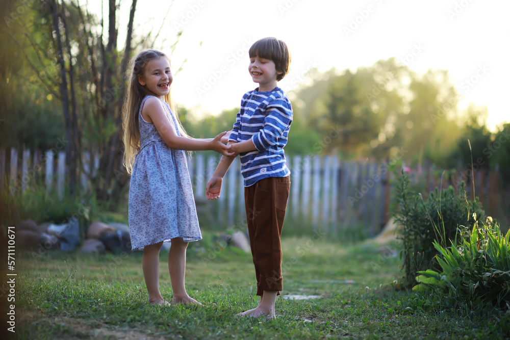 Children walk in the summer in nature. Child on a sunny spring morning in the park. Traveling with children.