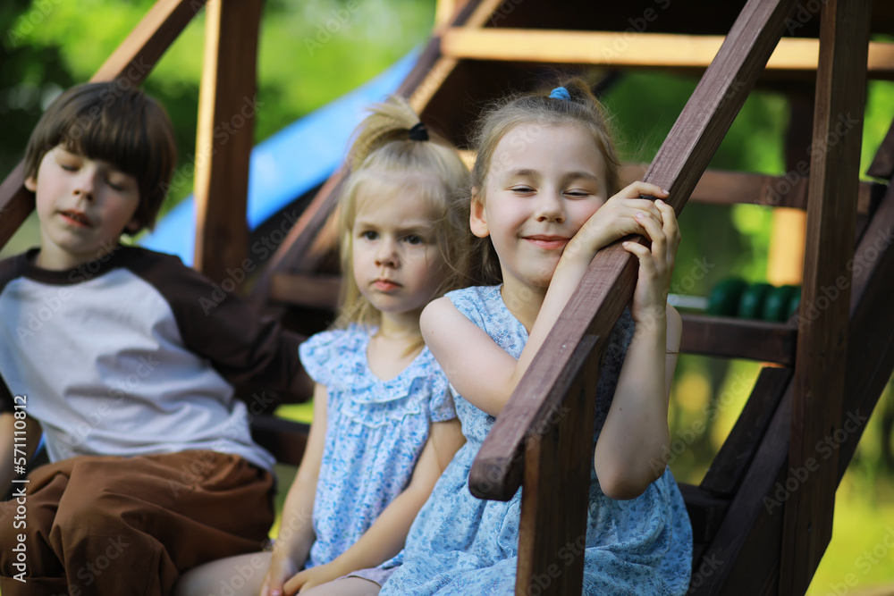 Children walk in the summer in nature. Child on a sunny spring morning in the park. Traveling with children.