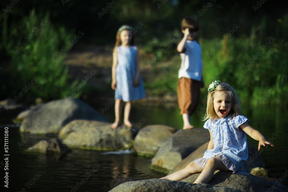 Children walk in the summer in nature. Child on a sunny spring morning in the park. Traveling with children. Children walk in the summer in nature. Child on a sunny spring morning in the park. Traveling with children.