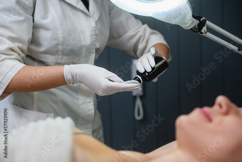 Lidocaine cure before electrolysis in beauty salon photo