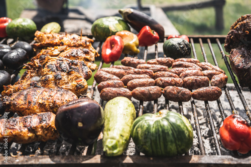Delicious grilled sausages and vegetables in Argentine grill, south american grilled style.