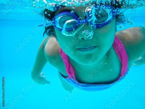 Wallpaper Mural Young girl swimming under water in summer Torontodigital.ca