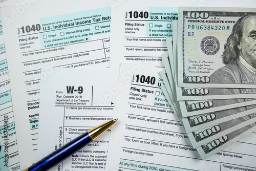 2022 blank individual income taform with dollar on desk