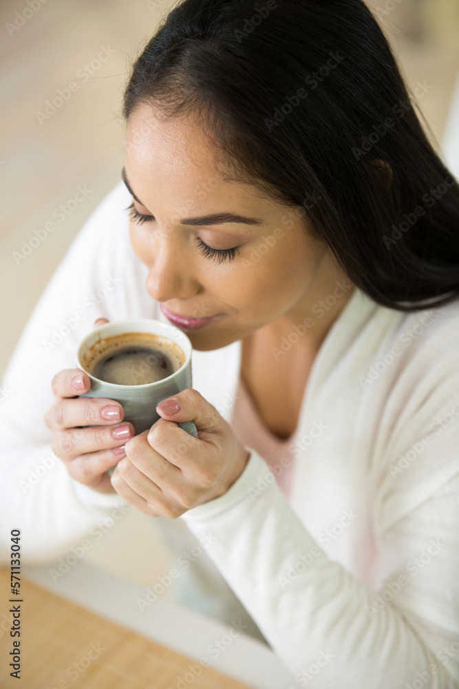 charming dreamy young woman holding hot drink charming dreamy young woman holding hot drink