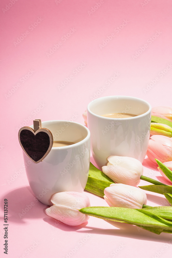 Valentine's Day romantic concept. Morning coffee, a bouquet of tulips, symbolic decor Valentine's Day romantic concept. Morning coffee, a bouquet of tulips, symbolic decor