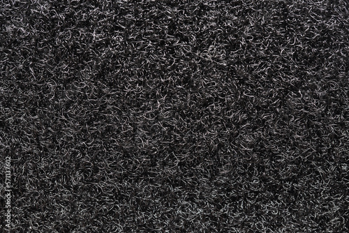 Velcro texture. Black fabric background. Textile pattern. Dark plastic fibers closeup. Fastening method little hooks. photo