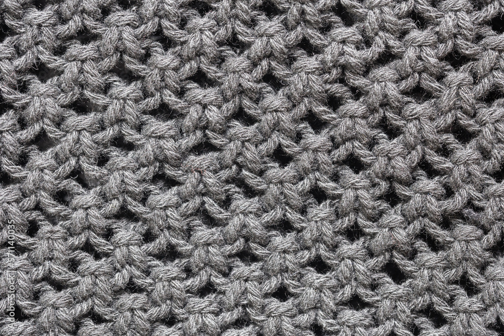 Knitwear background. Black woolen fabric texture. Warm jumper closeup. Yarn textile backdrop. Handmade sweater texture. Dark cotton pattern. Knitwear background. Black woolen fabric texture. Warm jumper closeup. Yarn textile backdrop. Handmade sweater texture. Dark cotton pattern.