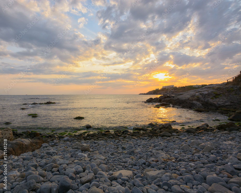 pebble coast at sunrise. gorgeous view of sozopol seascape. summer holiday at the sea