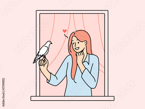 Smiling woman in house window holding pigeon in hands. Girl in love sending love letter with bird. Vector illustration. 