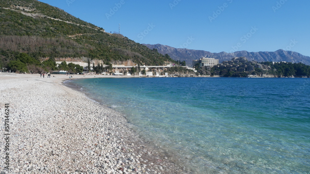 Blue sea water. Sunny day at the sea. Summer vacation at sea. Sea shore. Warm sea. Rest in Montenegro.