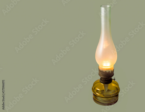 Obraz na płótnie Old kerosene lamp on a light green background.