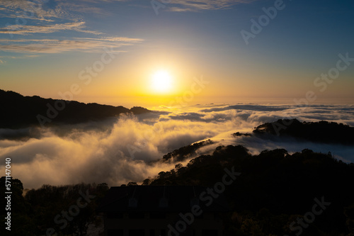 Layers of surging clouds are very spectacular. Sunset behind the mountains. The sea of clouds landscape. Dahu Township, Miaoli County, Taiwan