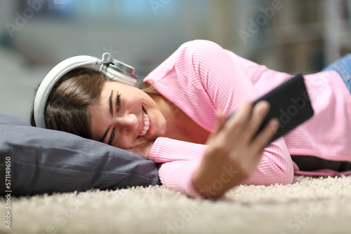 Happy teen watching media at home