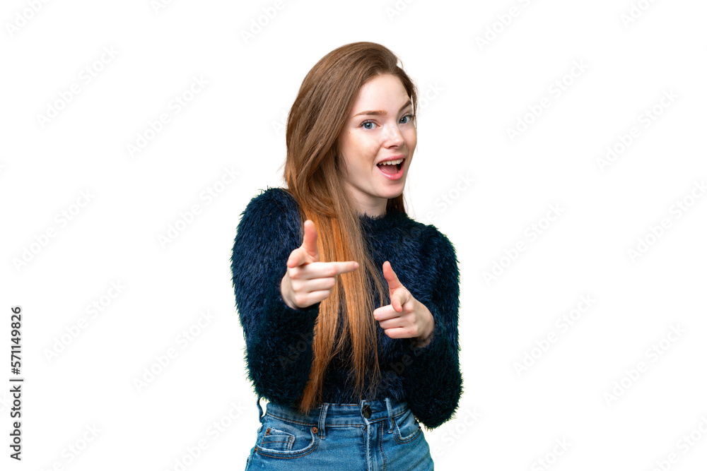 Young pretty woman over isolated chroma key background surprised and pointing front Young pretty woman over isolated chroma key background surprised and pointing front