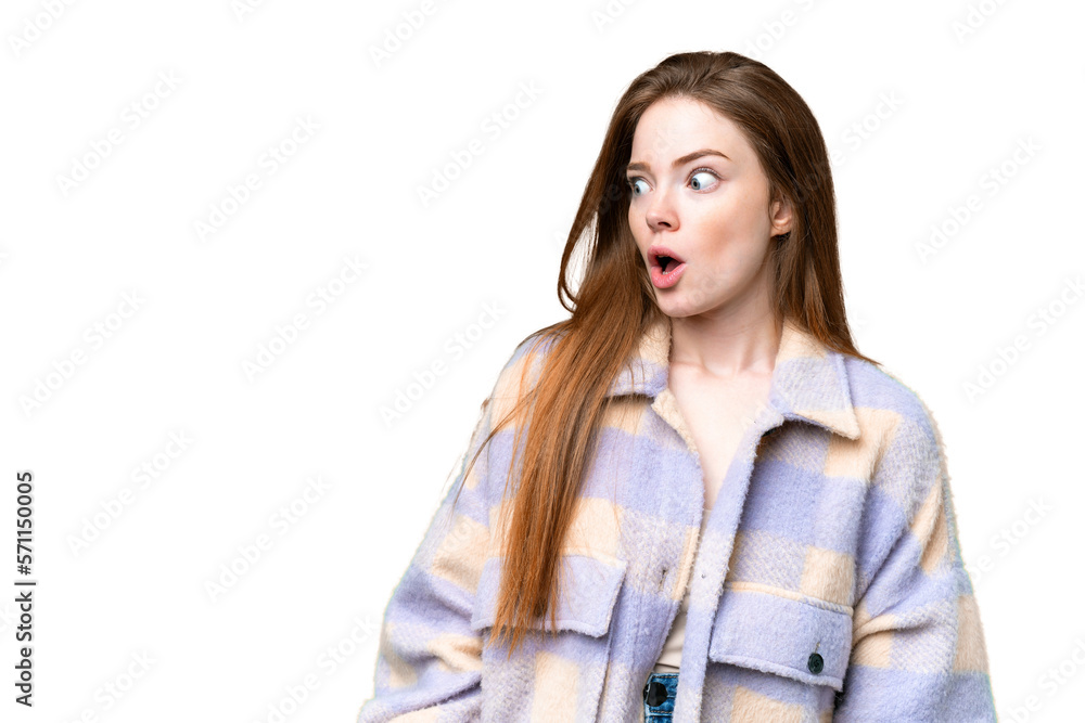 Young pretty woman over isolated chroma key background doing surprise gesture while looking to the side Young pretty woman over isolated chroma key background doing surprise gesture while looking to the side