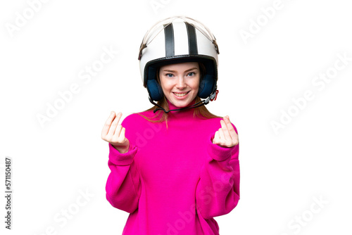 Young pretty woman with a motorcycle helmet over isolated chroma key background making money gesture