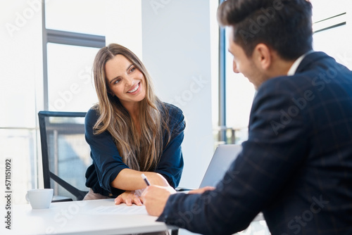 Wallpaper Mural Happy businesswoman completing recruitment process with candidate at office Torontodigital.ca