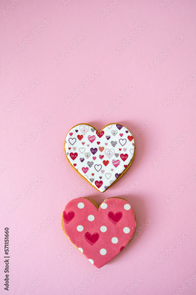 Gingerbread heart. Spring mood. Pastel colors. Delicious gingerbread on a light pink background. Sweet treats for lovers. Heart-shaped honey cake.