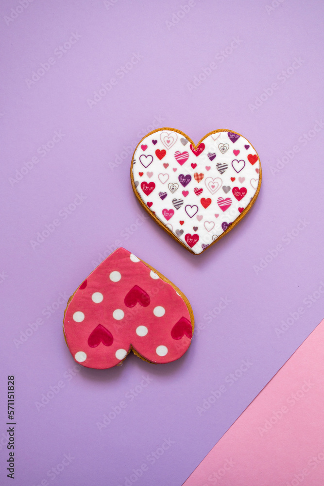 Gingerbread heart. Spring mood. Pastel colors. Delicious gingerbread on a light lilac color background. Sweet treats for lovers. Heart-shaped honey cake. 