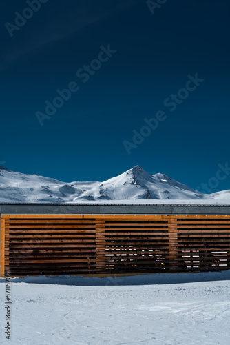 mountain hut in the snow, clear skies in Switzerland