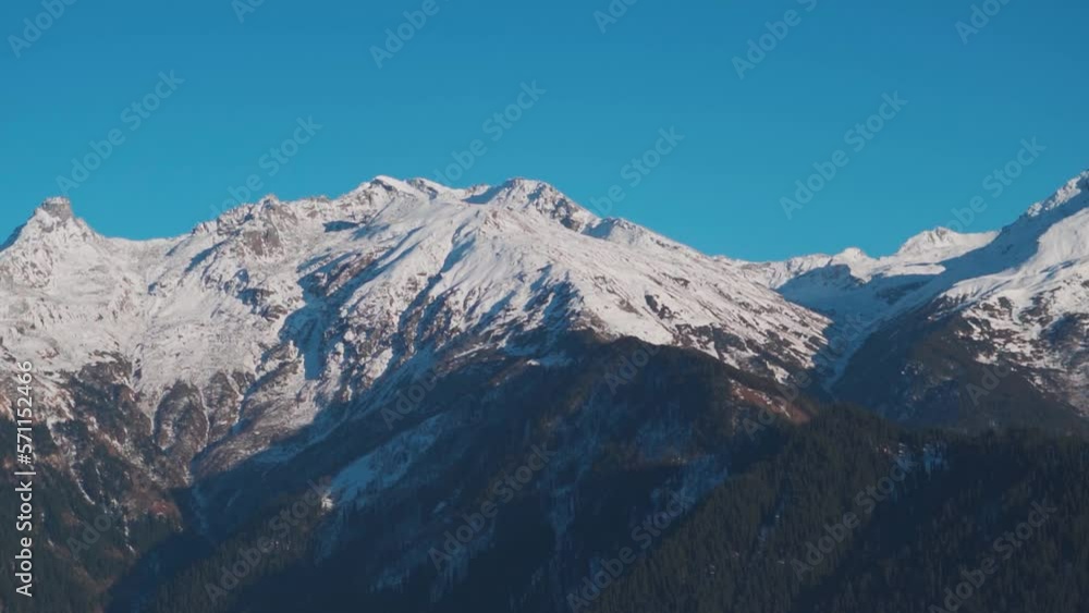 View of the snow covered mountains during the winter season at Manali in Himachal Pradesh, India. Snow covered mountain peaks during the winter in Himalayas. Natural winter snow mountain background. View of the snow covered mountains during the winter season at Manali in Himachal Pradesh, India. Snow covered mountain peaks during the winter in Himalayas. Natural winter snow mountain background.