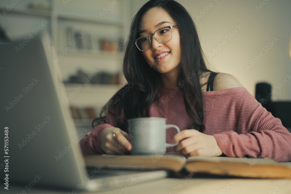 asian woman smiling witha a laptop asian woman smiling witha a laptop