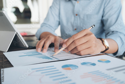 Businessman analyse investment marketing data.