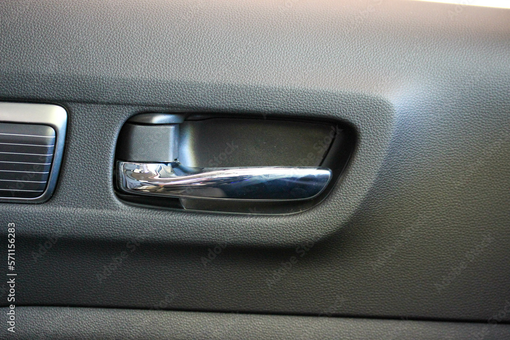 Chrome door handle inside a new vehicle