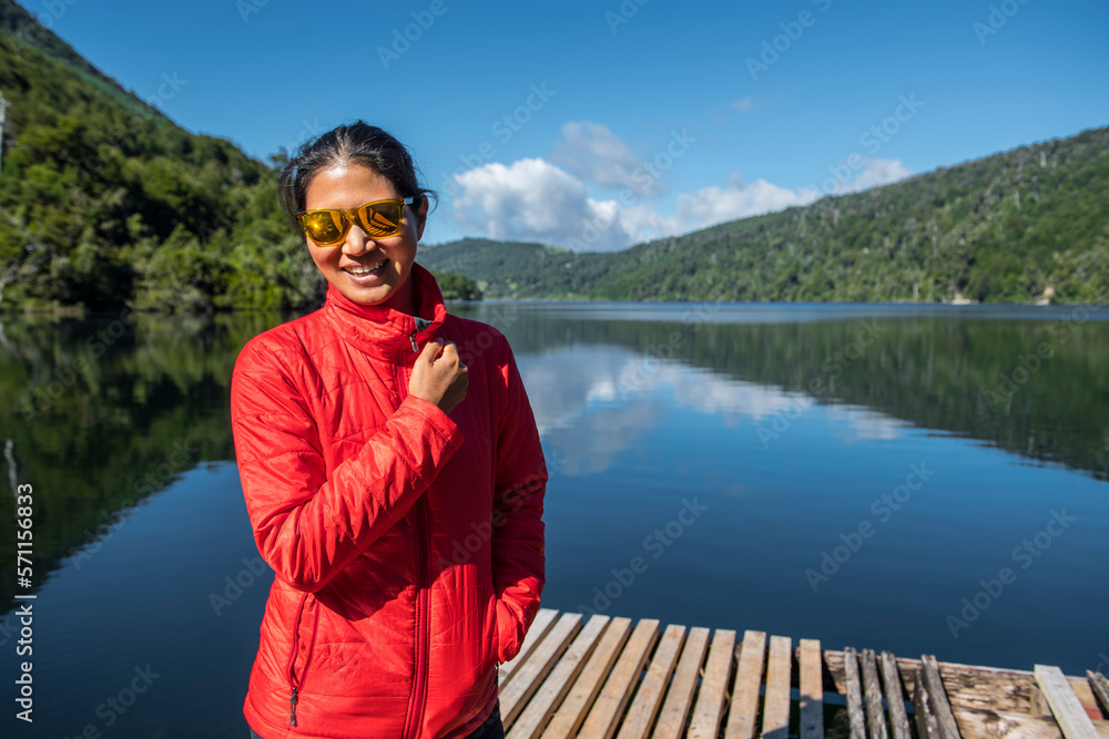 beautiful woman at still lake in the Chilean Lake District beautiful woman at still lake in the Chilean Lake District