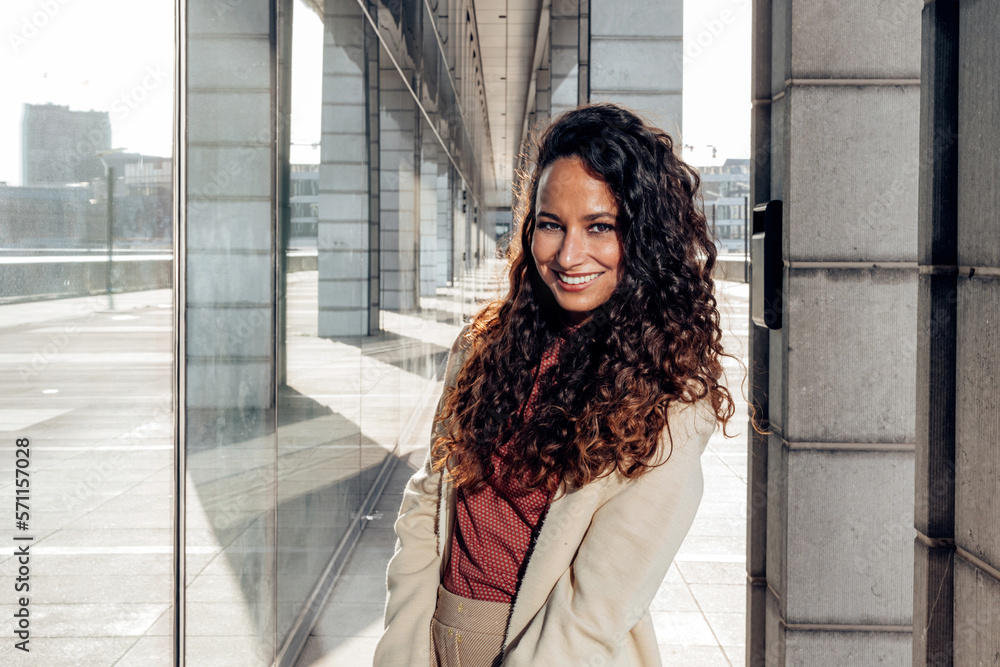 Fototapeta premium outdoors photo portrait of elegant smiling Hispanic lady looking at camera