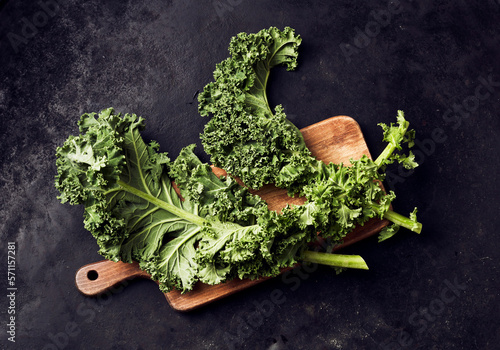 Studio shot of fresh kale (Brassica oleracea)on cutting board