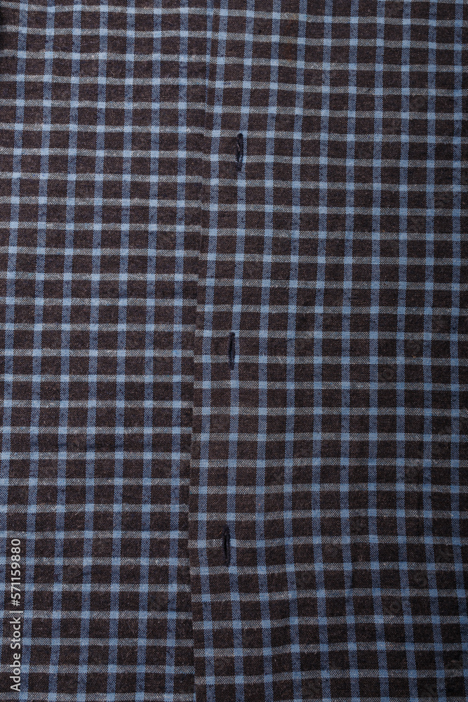 dark blue checkboard pattern shirt fabric background, garment texture with buttons, vertical shot dark blue checkboard pattern shirt fabric background, garment texture with buttons, vertical shot