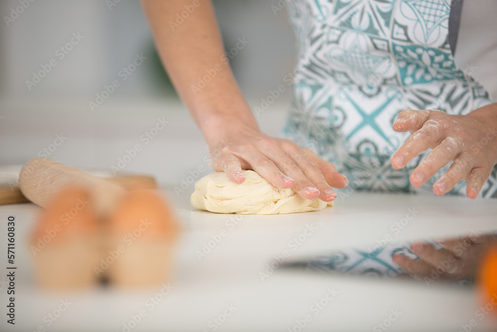 a woman baking pies in her home kitchen a woman baking pies in her home kitchen