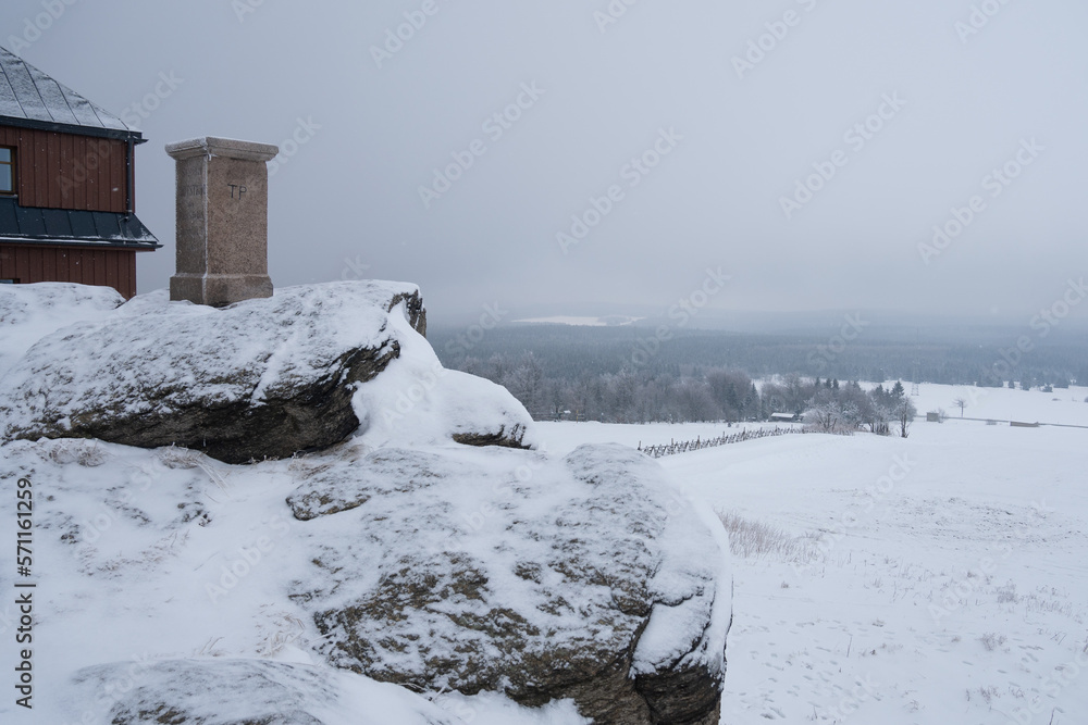 Foggy winter on Hirtstein Mountain, Satzung (Erzgebirge). German Ore Mountains with snow, hoar frost and a triangulation column with german inscription regarding land survey. Foggy winter on Hirtstein Mountain, Satzung (Erzgebirge). German Ore Mountains with snow, hoar frost and a triangulation column with german inscription regarding land survey.